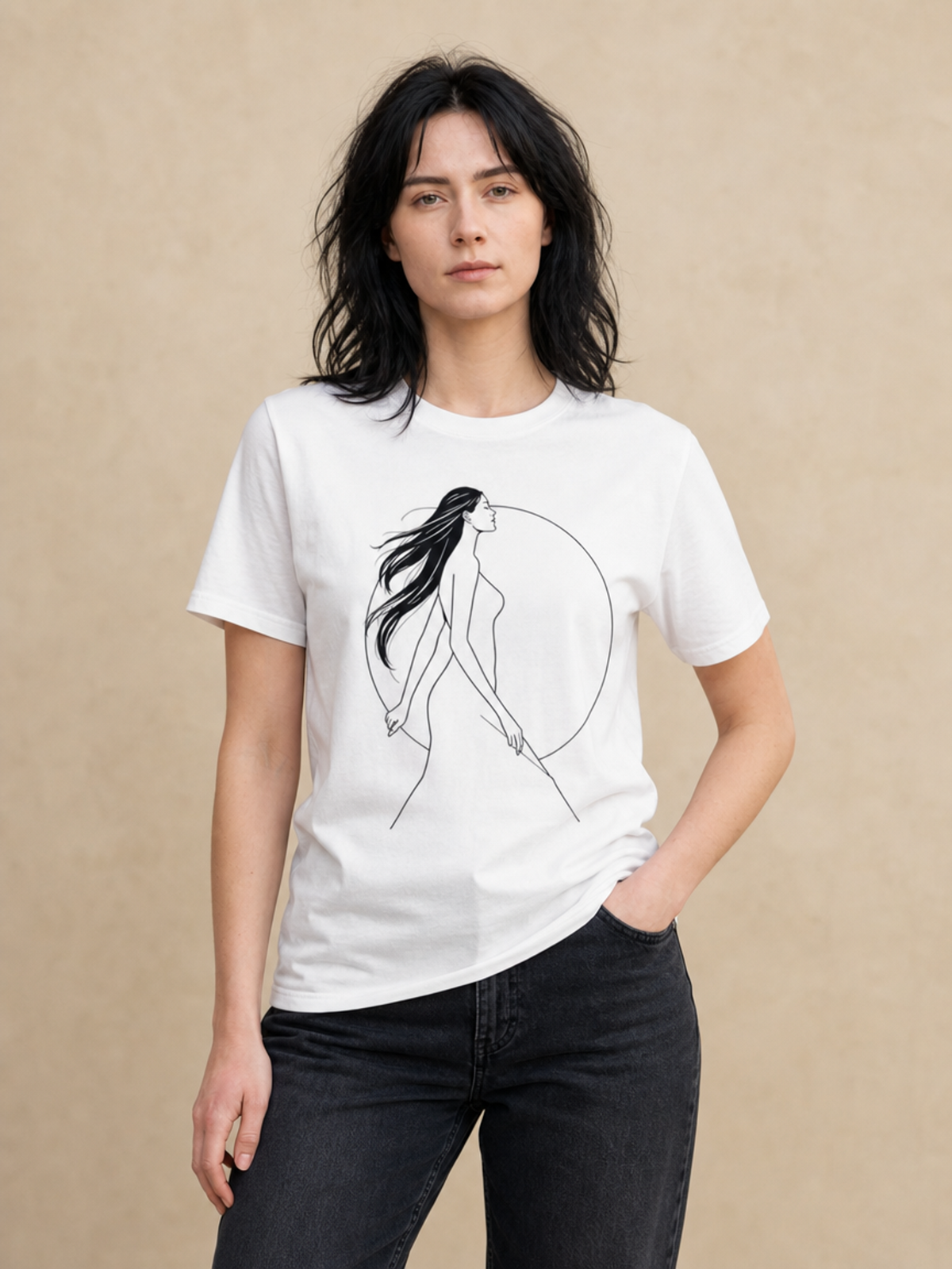 A woman modeling a white short-sleeve crewneck t-shirt with a minimalist black line art graphic of a woman walking inside a circle on the front, set against a textured beige background.