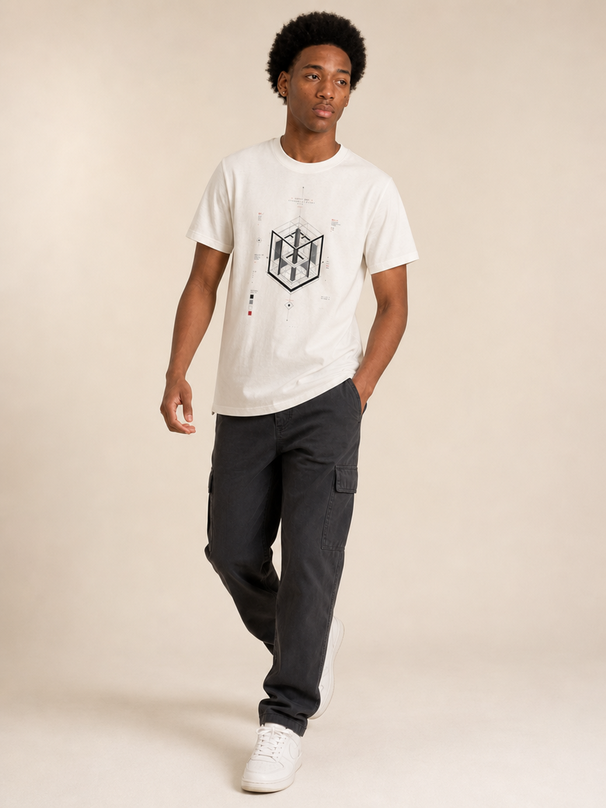 A male model wearing a white crew neck t-shirt featuring a centered black-and-grey geometric architectural blueprint graphic, paired with white trousers against a neutral background.