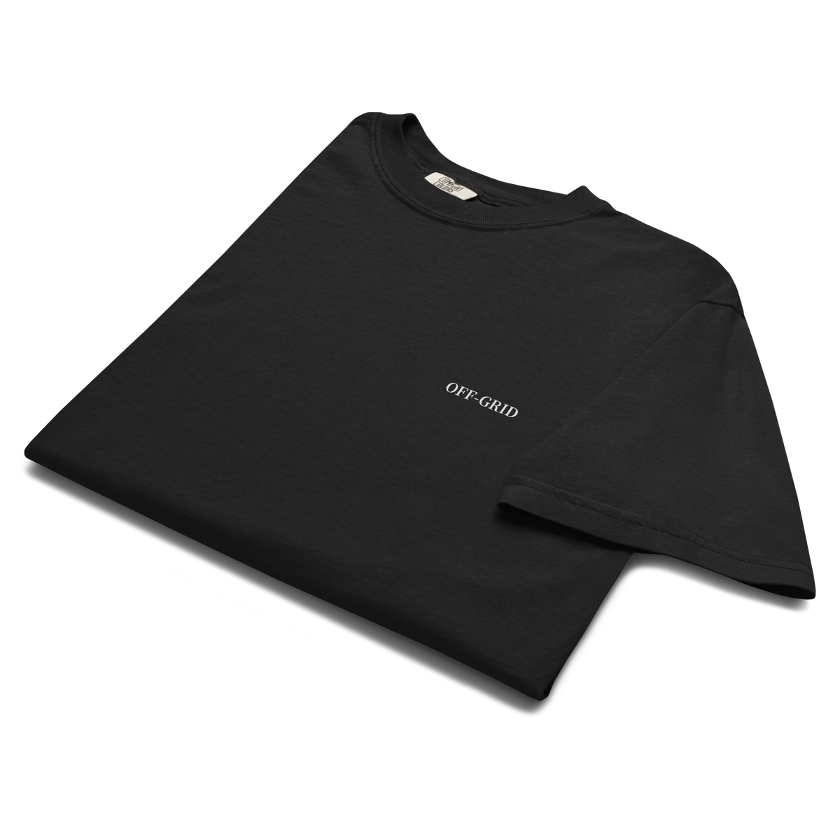 A folded black short-sleeve t-shirt with a tonal black graphic on the left chest, displayed on a clean white background.